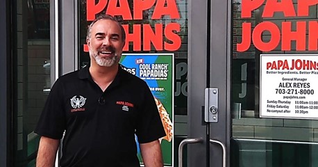 Andy Freitas outside one of his Papa Johns restaurants