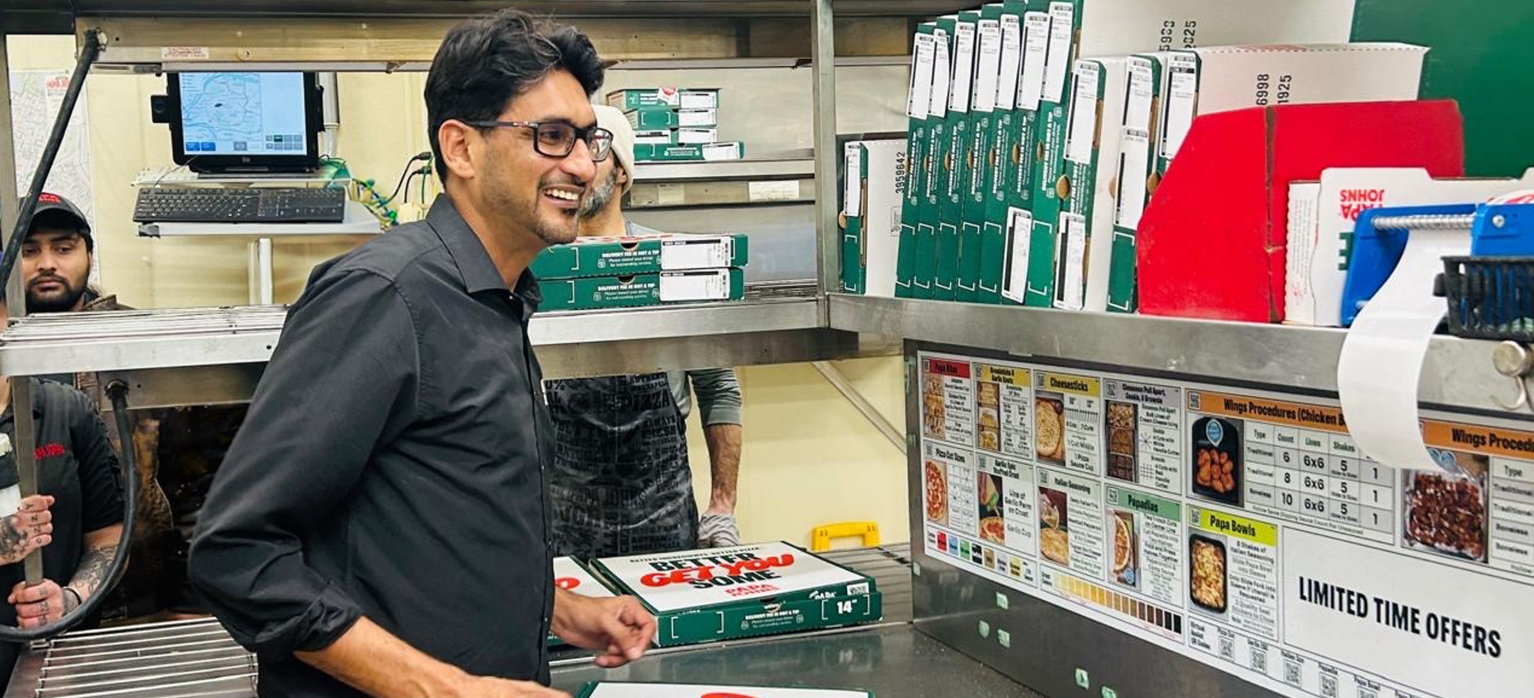 Yasir Hussain inside one of his Papa Johns restaurants