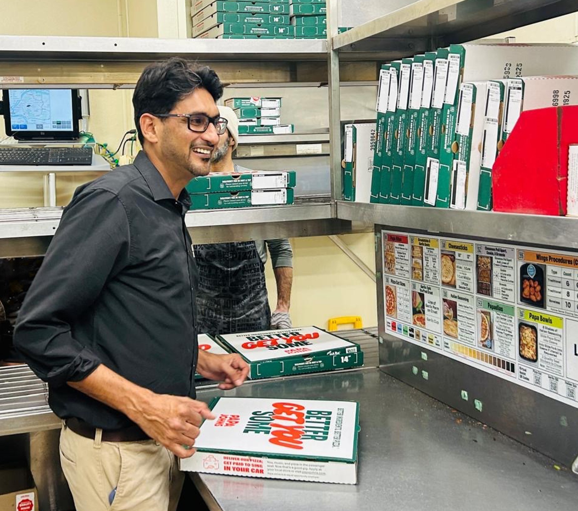 Yasir Hussain inside one of his Papa Johns restaurants