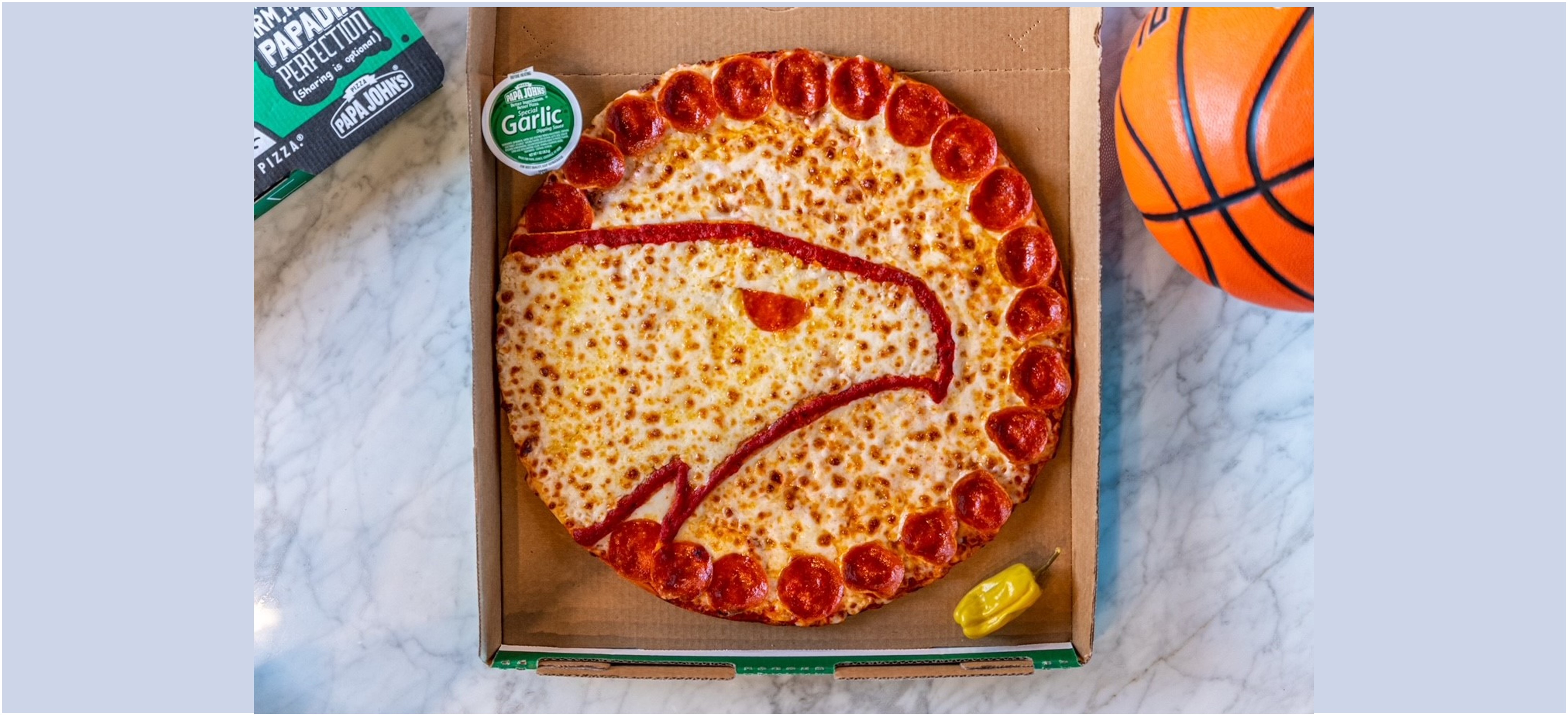 Hawks logo on Papa Johns pizza