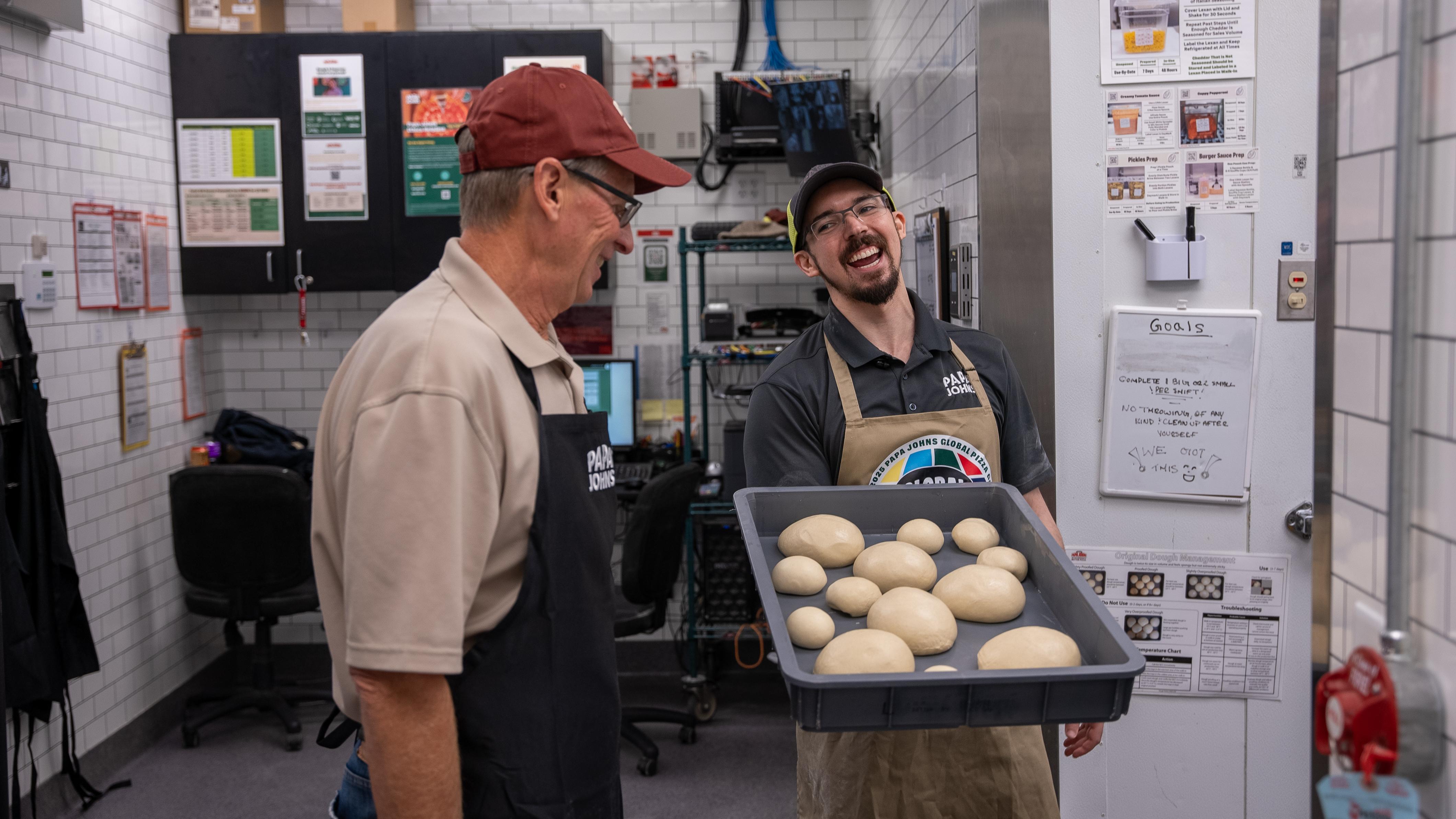 Todd assists Papa Johns team members