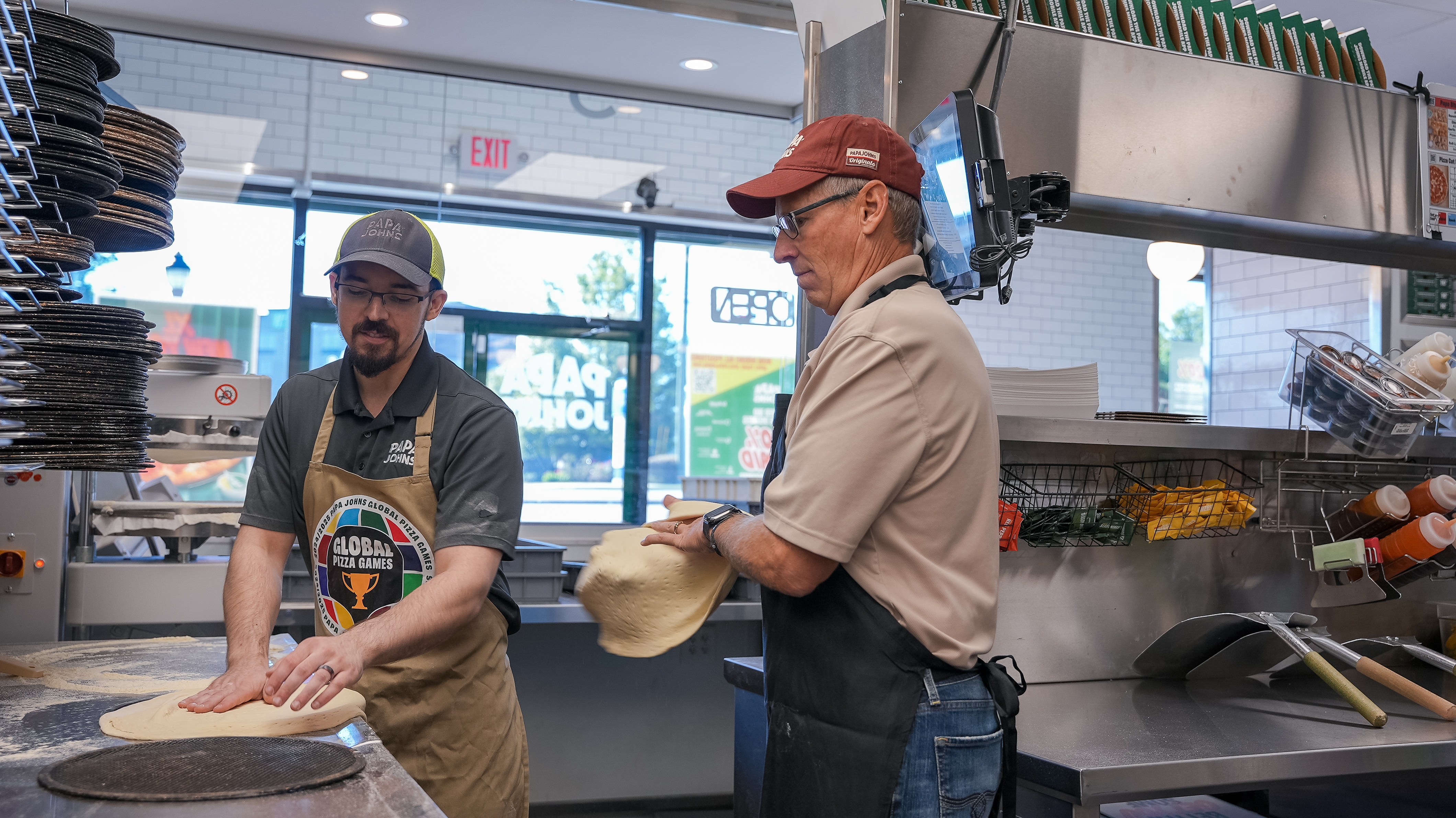 Todd assists Papa Johns team members