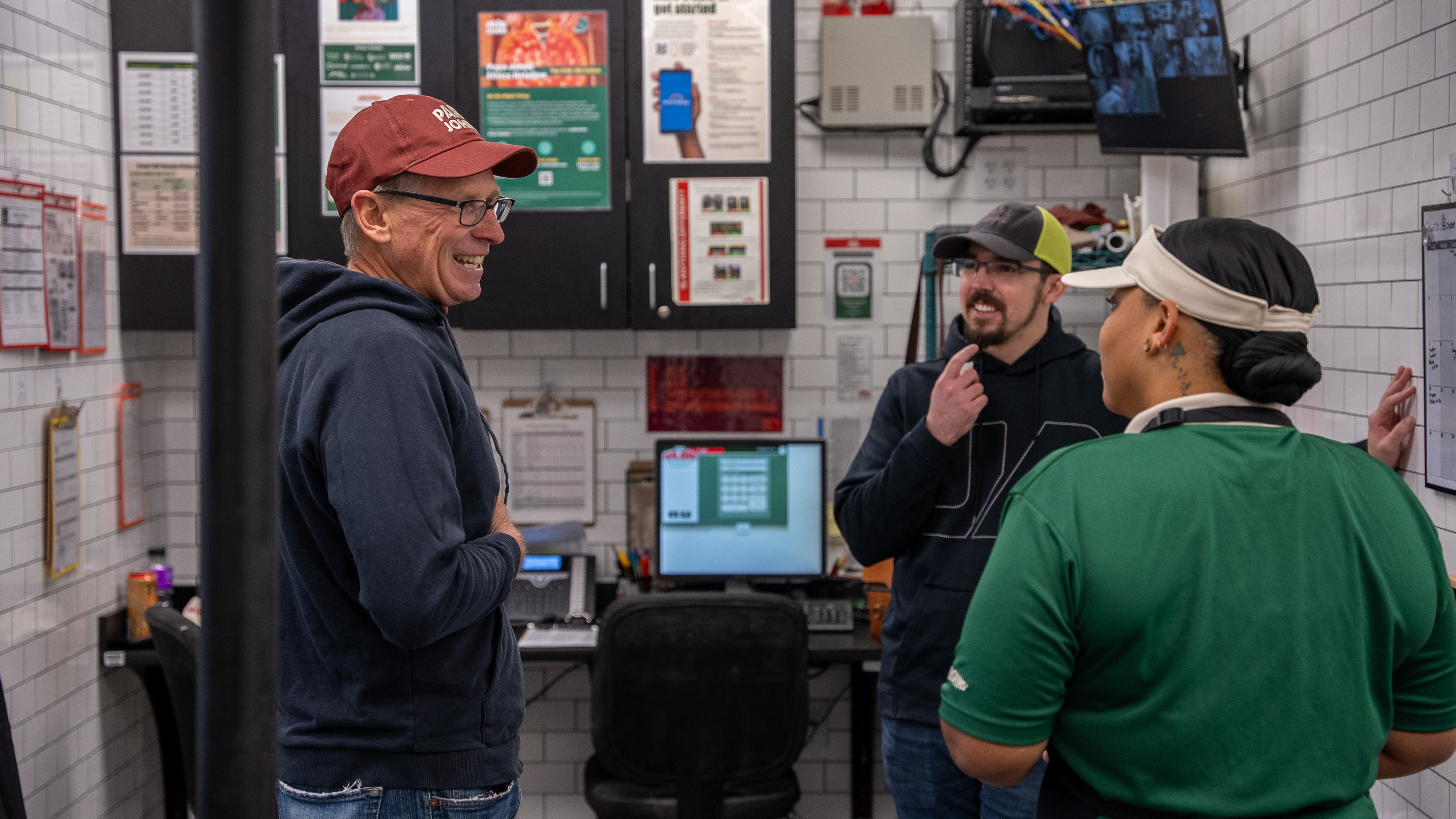 Todd Penegor speaks with team members