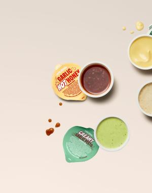 Four garlic dips set on a table