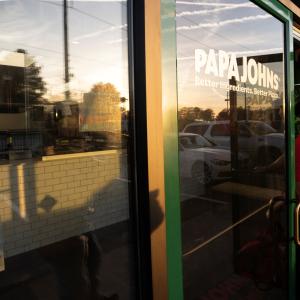 Driver exiting Papa Johns restaurant - B