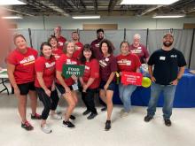 Louisville team members participate in Dare to Care’s National "Food Fight" Volunteer Day 