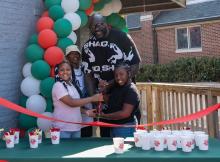 Shaq and local youths cut the ribbon at new Papa Johns restaurant