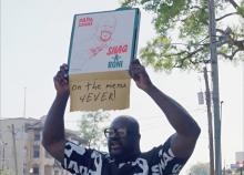 Shaquille O'Neal holding a Shaq-a-Roni box