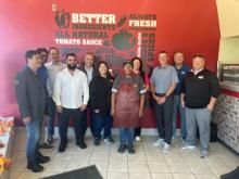 Todd Penegor meets with team members at a Papa Johns restaurant