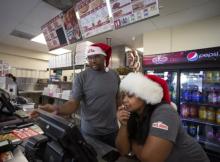 Jarvis and Josslyn Young working in their Papa Johns restaurant