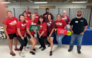 Louisville team members participate in Dare to Care’s National "Food Fight" Volunteer Day 