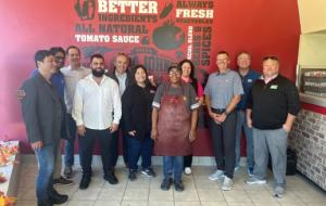 Todd Penegor meets with team members at a Papa Johns restaurant