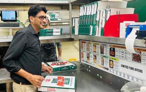 Yasir Hussain inside one of his Papa Johns restaurants