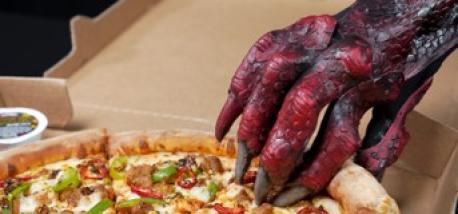 A dragon's claw grabbing a pizza