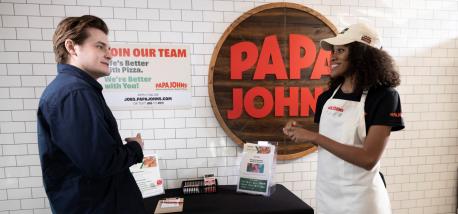 Papa Johns team member interviews a recruit