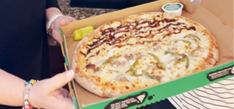 Donna Kelce is delivered a pizza from Papa Johns