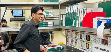 Yasir Hussain inside one of his Papa Johns restaurants